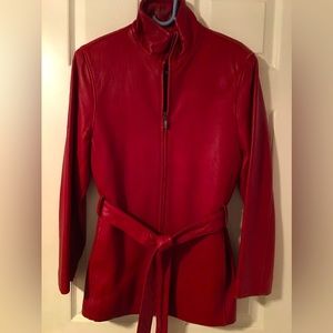Red leather jacket with zip front and belt Quality leather- like new. Gorgeous!